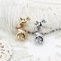 Detailed view of dual-tone giraffe brooches with gold and silver finishes and crystals - 13*27.5mm / Gold Fawn