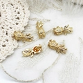 Macro view of five 18K gold-plated goldfish charms for DIY jewelry making - Koi Fish