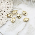 Set of six 18K gold plated snail pendants for DIY jewelry making on white lace - Conch
