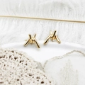 Elegant 18K gold-plated knotted baroque earrings on a soft white feather background - Gold Twisted Knot Line Style