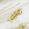 18K gold-plated fish bone charm pendant with zircon eye for DIY jewelry making - Fishbone