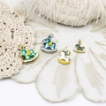 18K gold plated copper rocking horse pendants in four colors on white lace fabric - 18K Gold Blue-Green Rocking Horse (16.5x18.5mm)