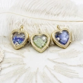 Detailed macro of heart locket pendants with gold frames and colorful gemstone fillers - Dark Blue Color Beads Heart (M0557)
