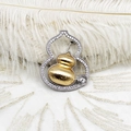 Macro detail of brushed gold gourd brooch with white diamond pavé on lace background - 32*39mm