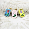 Three elegant tulip enamel pendants in gold frames with red white and purple flowers - Pink Tulip Square