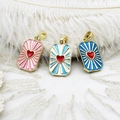 Golden tarot heart pendants with radiant sunburst enamel in pink, sky blue, and deep blue colors - Pink Heart Square
