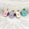 Detailed macro view of gold-plated enamel angel charms for DIY jewelry accessories - Pink Angel Square