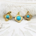 Three gold pendants with turquoise stones on elegant white lace and feather background - Bird's Nest Rhombus Style
