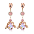 Detailed close-up of multi-layer crystal earrings with drop-shaped champagne stones - Pink (KC Gold)
