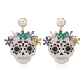 Halloween skull earrings with colorful rhinestones and pearl studs on white background - Skull Style / White