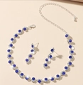 Elegant silver jewelry set featuring blue crystal wave necklace and matching earrings - Blue