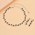 Elegant jewelry set featuring silver wave necklace and earrings with black rhinestones - Black