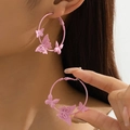 Pink matte hoop earrings with three dimensional butterflies shown on a model - Pink (Eb-1-e023)