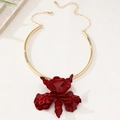 Detail view of large red floral pendant on a sleek gold choker with adjustable lobster clasp - Burgundy