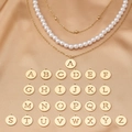 Detail of layered gold chain necklace with white pearls and 26 alphabet pendants - Letter A Style (X1066-A)