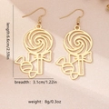 Orecchini a forma di lecca-lecca dorati con design a spirale e fiocco, 6,6 cm - Oro