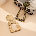 Detail of bohemian geometric dangle earrings featuring hammered metal and leopard print patterns - Geometric Drop Style (E0160) / Green Leopard