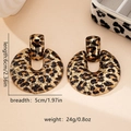 Detail view of large leopard print earrings showing dimensions 6cm x 5cm and 24g weight - Gold Leopard Print (E0157)