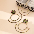 Macro shot of neon leopard print geometric circle pendant and earrings jewelry set - Green Leopard Print (T056)