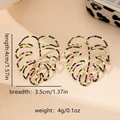 Detailed view of monstera leaf earrings with dimensions 4cm length and 3.5cm width - Leopard Hollow (E1429-Green) / Green