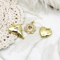 Detailed view of 18K gold plated heart pendants with zircon stones and sunburst design - Star Heart