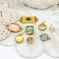 Gold-plated pendants collection featuring jade and gemstones on white lace fabric background - Double Ring Five Lines Jasper 11.6*29.6mm