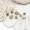 Detail of Hamsa Hand and Evil Eye gold plated charms with blue rhinestones and enamel - Navy Blue Small Round Eye