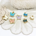 Detailed view of colorful butterfly and rocking horse charms in 18K gold plated metal - Rocking Horse / 13*13mm / White