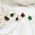 Detailed view of various gemstone pendants including tiger eye and malachite in gold settings - Tiger Eye Stone Rectangle Style
