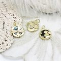 Detailed view of 18K gold-plated charms with butterfly bee and moon rabbit shell inlays - Square Butterfly