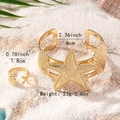 Dettaglio delle dimensioni del set di gioielli stella marina e conchiglia sulla sabbia - Set Aperto Stella Marina e Conchiglia (S225)