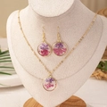 Elegantes Set aus Harzschmuck mit lila Trockenblumen an Halskette und Ohrringen - Runde Blume