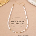 Detail view of white heishi bead necklace with adjustable lobster clasp and 40cm length - White Polymer Clay Gold Bead Beaded Necklace (X780)