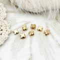 Close-up of 18K gold plated cross beads with smooth and radiating textures for DIY jewelry - Patterned Cross (6*6mm)