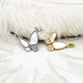 Colgante mariposa con concha blanca y circonita en acabados oro 18k y plata - Color Oro Blanco (16*19.3mm)