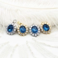 Macro detail of oval blue sapphire pendants with sparkling micro-pave zircon crystals - Oval Zirconia White Gold Color (Single Loop)