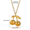 Detailed view of a gold cherry pendant necklace featuring smooth spherical charms and a leaf - Cherry Style (N07595)