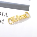 Adorno dorado para zapatos Libra en fuente gótica hecho de acero inoxidable - Libra