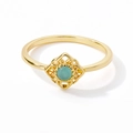 Detailed macro view of gold-plated ring with round pale blue opal and hollow floral setting - Hollow Geometric Light Blue Gemstone Style (JZ808G-T)