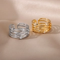 Close-up of gold and silver multi-layer winding rings with sparkling cubic zirconia stones - Multi-layer Winding Gold
