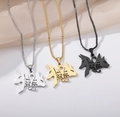 Detailed view of Tree of Life and Ankh necklaces in silver, gold, and black steel - Egyptian Anubis Ankh Style / Gold
