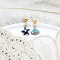 Detailed macro view of asymmetric starfish and seashell earrings with zircon accents - Starfish Scallop Pair 11.7*23.2mm