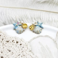 Macro shot of sea star and shell earrings with white pearls and sparkling rhinestones - Blue Starfish Shell Pair 16*17.7mm