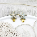 Blue enamel starfish earring mount with gold accents and cubic zirconia on a white feather - Blue Starfish Pair 14.5*18.5mm