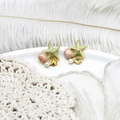 Detailed shot of starfish and seashell earrings with pearls on a decorative white dish - Green Pink Starfish Shell Pair 15*15mm