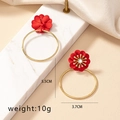 Detailed view of red enamel flower earrings with crystal center and size markings - Wine Red Flower