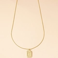 Minimalist gold snake chain necklace with rectangular letter T pendant and grooved edges - Letter G