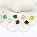 Close-up of square multi-faceted colorful crystal pendants with 18K gold plated frames - Square 12x14.2mm / Pink
