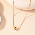 Minimalist gold heart necklace featuring a matte letter A pendant on a snake bone chain - Letter A