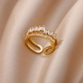 Close-up of golden double-layer ring with rectangular zircon and crown design on silk - Double Layer Irregular Crown Fully Inlaid Style (G7194361)